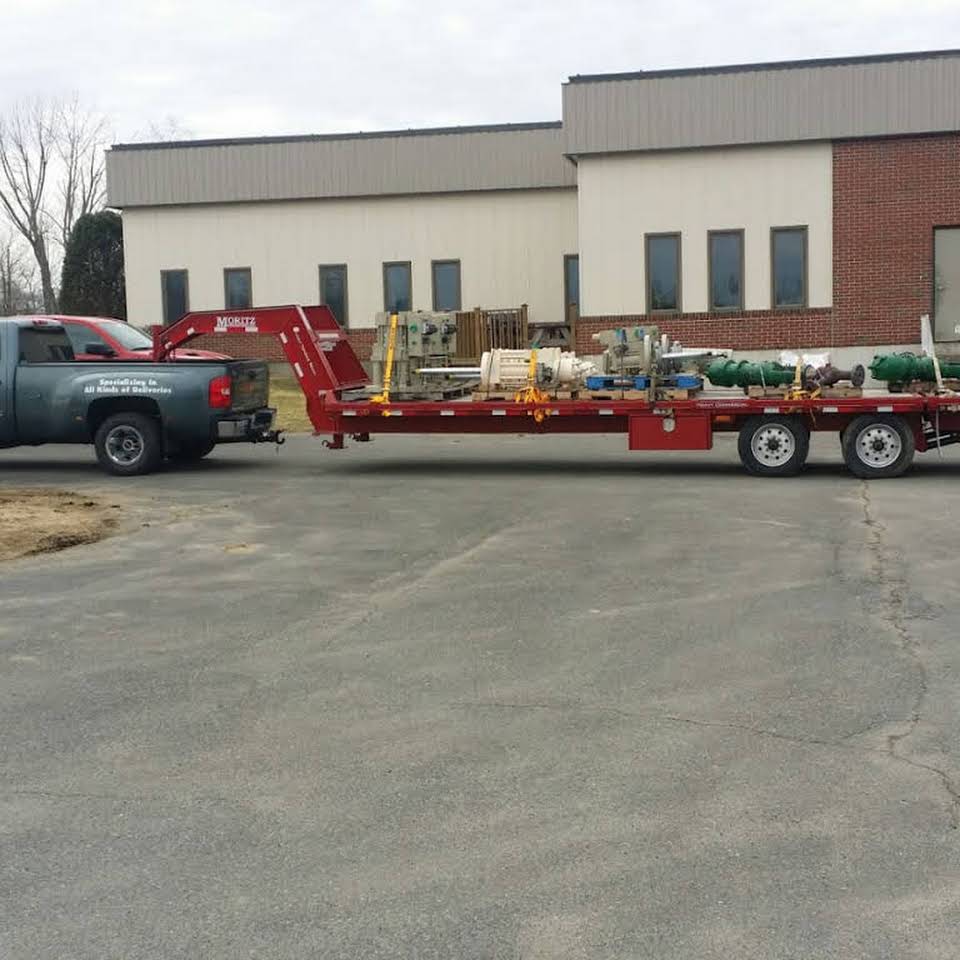 Flat bed truck parked while delivering hotshot trucking goods